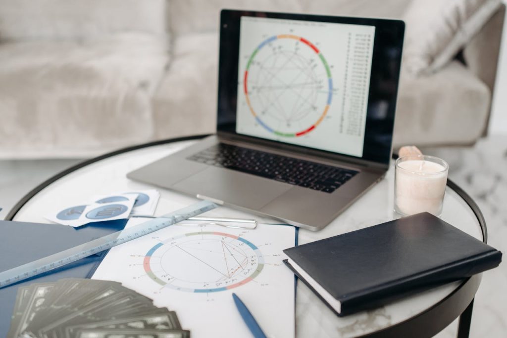 Horoscope Cards and Laptop on a Table 